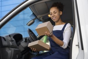woman holding package for last-mile delivery